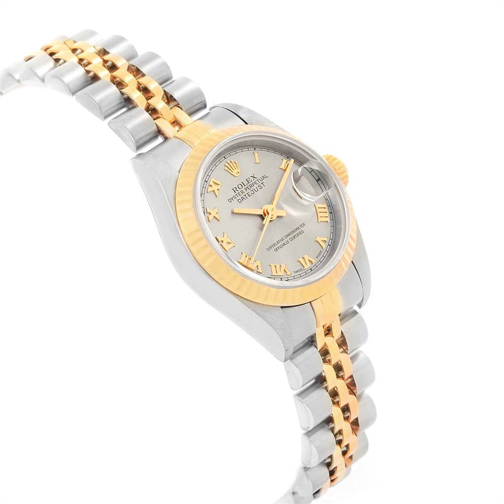 The image shows a side angle of the Rolex Datejust 69173 Women's Stainless Steel Grey Dial 69173 Women's Stainless Steel Grey Dial, highlighting its two-tone bracelet, fluted bezel, and silver dial.