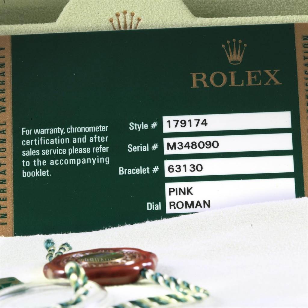 The image shows the warranty card for a Rolex Datejust 179174 Women
s Stainless Steel Pink Dial 179174 Women
s Stainless Steel Pink Dial model, displaying style, serial, bracelet numbers, and dial information.