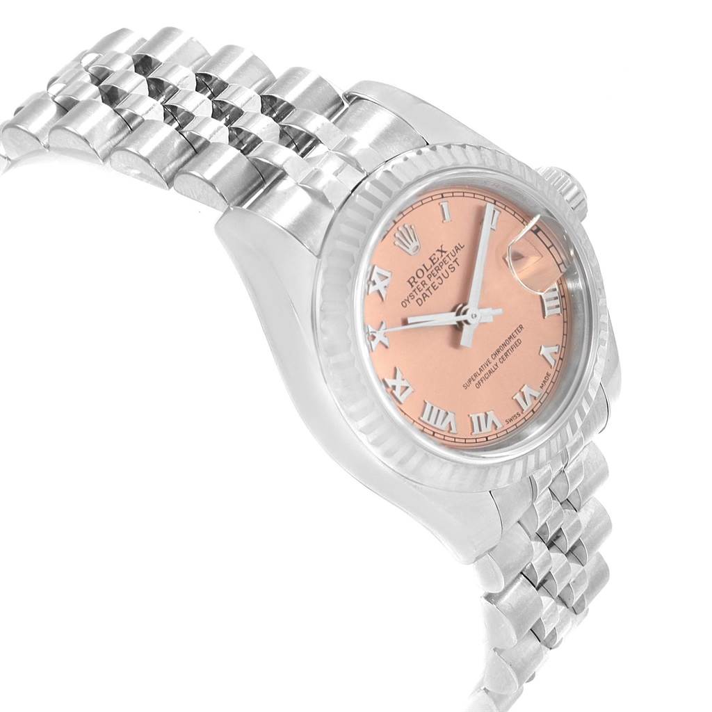 This image shows a side angle of the Rolex Datejust 179174 Women
s Stainless Steel Pink Dial 179174 Women
s Stainless Steel Pink Dial watch, highlighting its pink dial, fluted bezel, and bracelet.