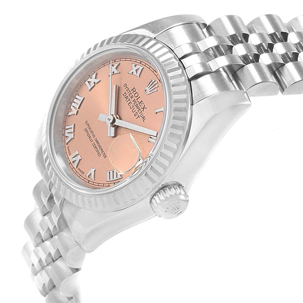 The image shows a side angle of the Rolex Datejust 179174 Women
s Stainless Steel Pink Dial 179174 Women
s Stainless Steel Pink Dial watch, highlighting the dial, case, crown, and part of the bracelet.