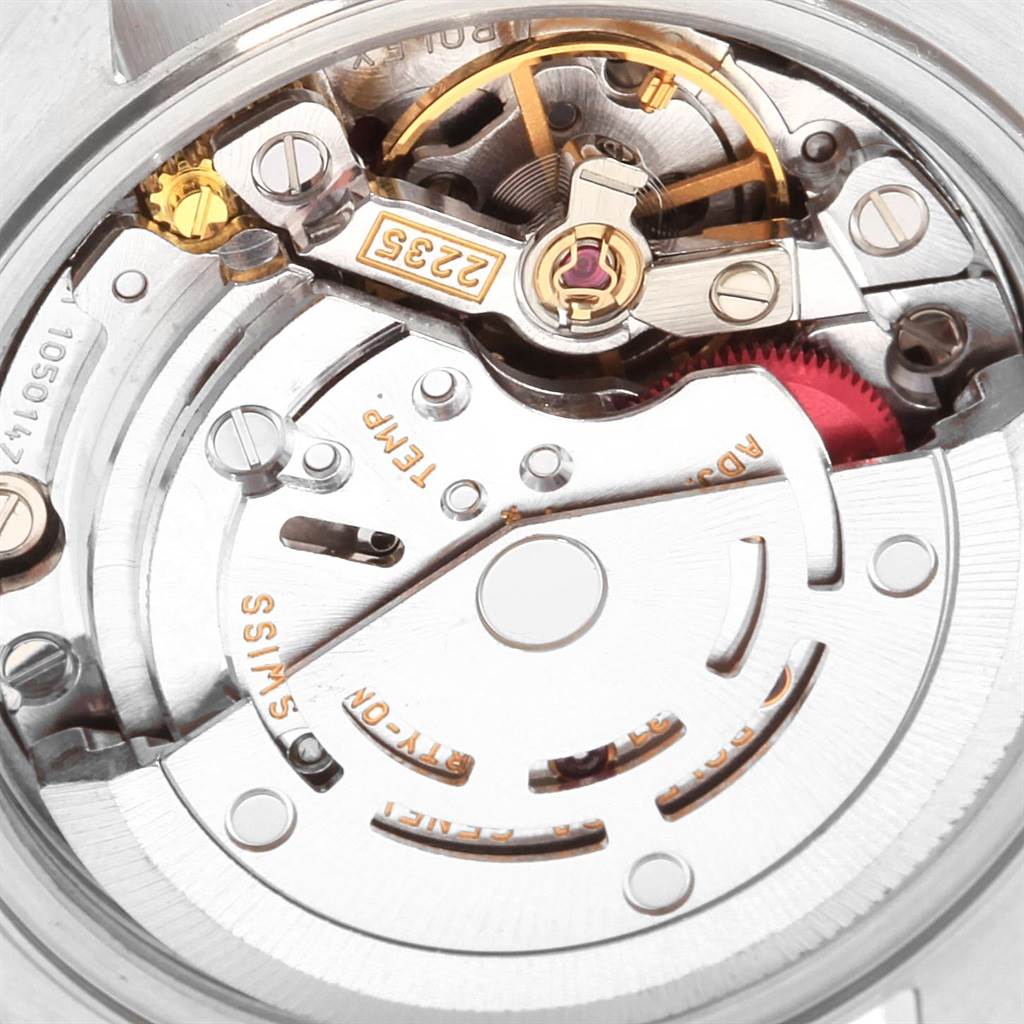 The image shows a close-up of the movement of a Rolex Datejust 79174 Women's Stainless Steel Silver Dial 79174 Women's Stainless Steel Silver Dial watch, highlighting its intricate mechanical parts.