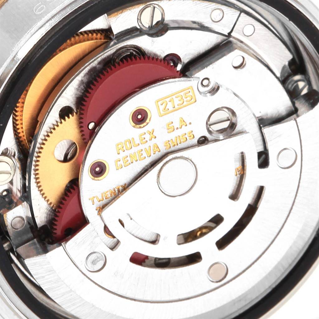 This image captures the internal movement mechanism of a Rolex Datejust 69173 Women's Stainless Steel White Dial 69173 Women's Stainless Steel White Dial watch, highlighting gears and the rotor mechanism.