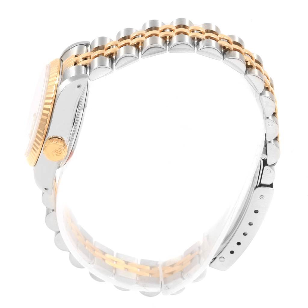 The side angle of the Rolex Datejust 69173 Women's Stainless Steel White Dial 69173 Women's Stainless Steel White Dial watch shows the crown, part of the case, and the two-tone bracelet.