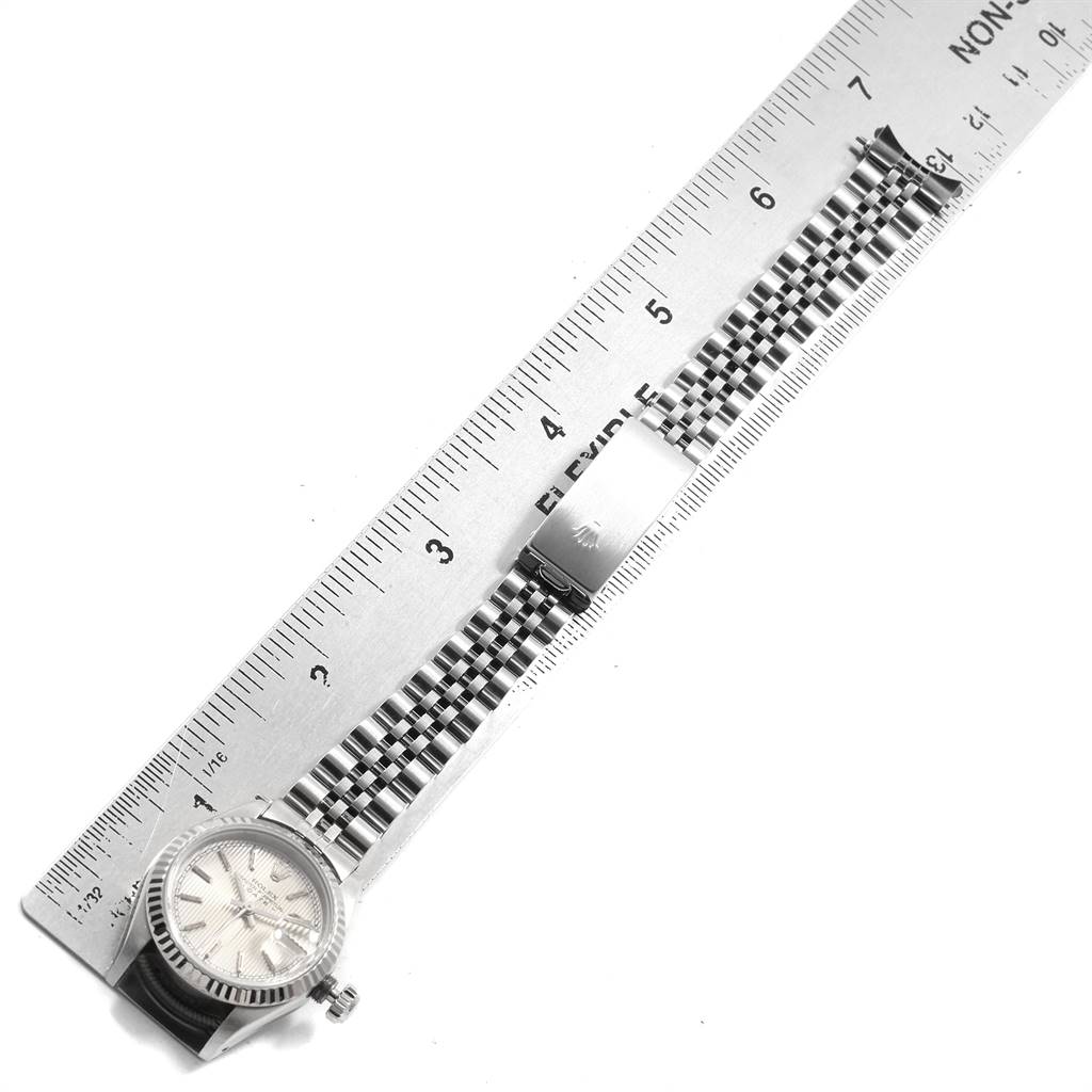 The image shows a Rolex Datejust 69174 Women's Stainless Steel Silver Dial 69174 Women's Stainless Steel Silver Dial watch laid flat, with its case, dial, and metal bracelet measured by a ruler.