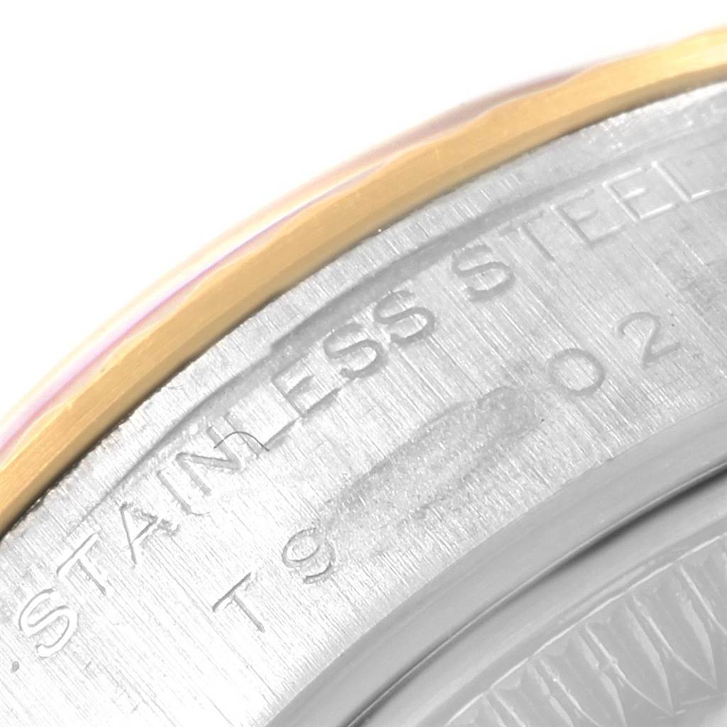 This image shows a close-up of the stainless steel back and outer edge of a Rolex Datejust 69173 Women's Stainless Steel White Dial 69173 Women's Stainless Steel White Dial watch.