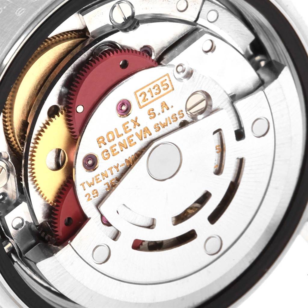 The image shows the internal movement mechanism of a Datejust model Rolex watch from a close-up angle.