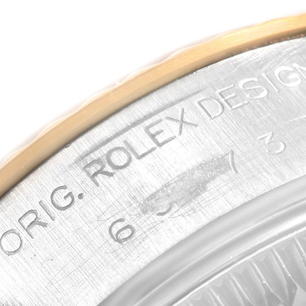 The image shows a close-up angle of the case back engraving on a Rolex Datejust 69173 Women's Stainless Steel White Dial 69173 Women's Stainless Steel White Dial watch.