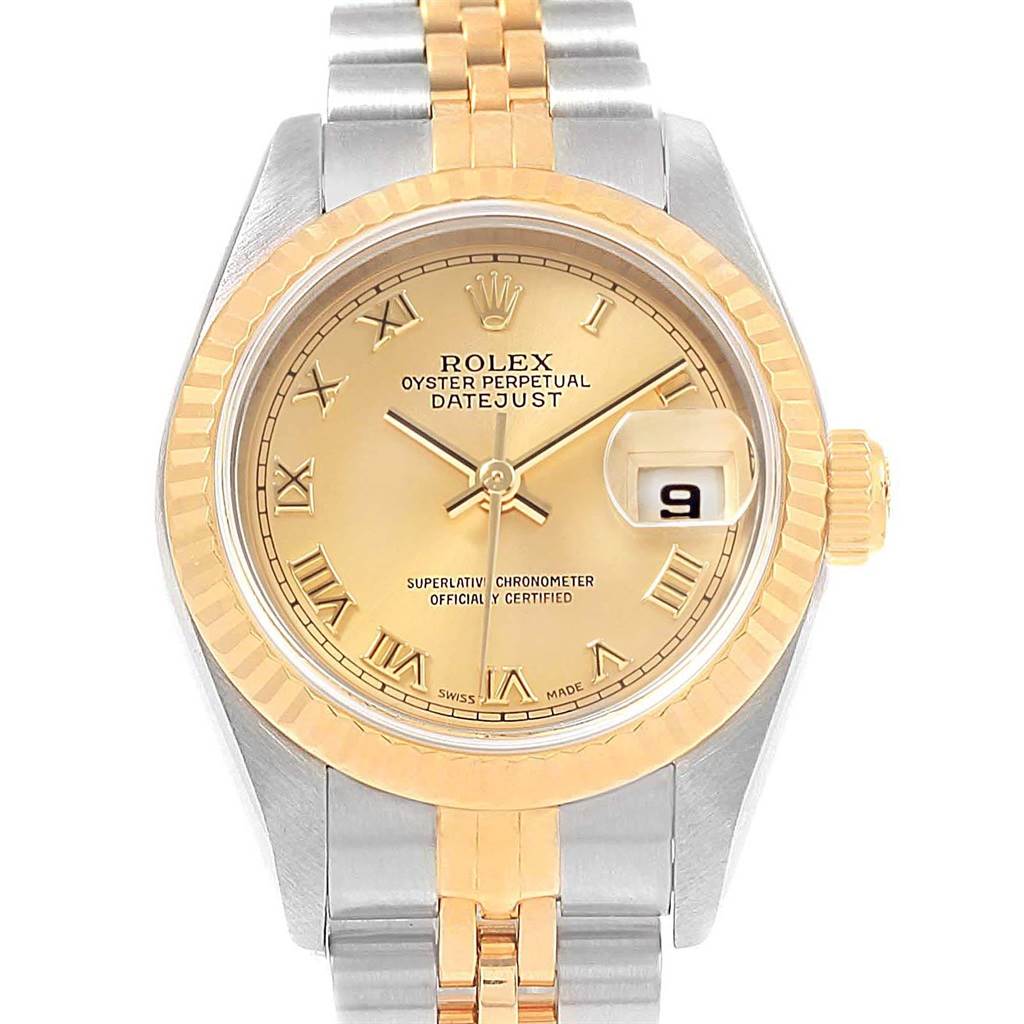 This Rolex Datejust 79173 Women's Steel and Gold (two tone) Champagne Dial 79173 Women's Steel and Gold (two tone) Champagne Dial watch is shown from a front angle, highlighting its gold face, Roman numerals, and two-tone bracelet.