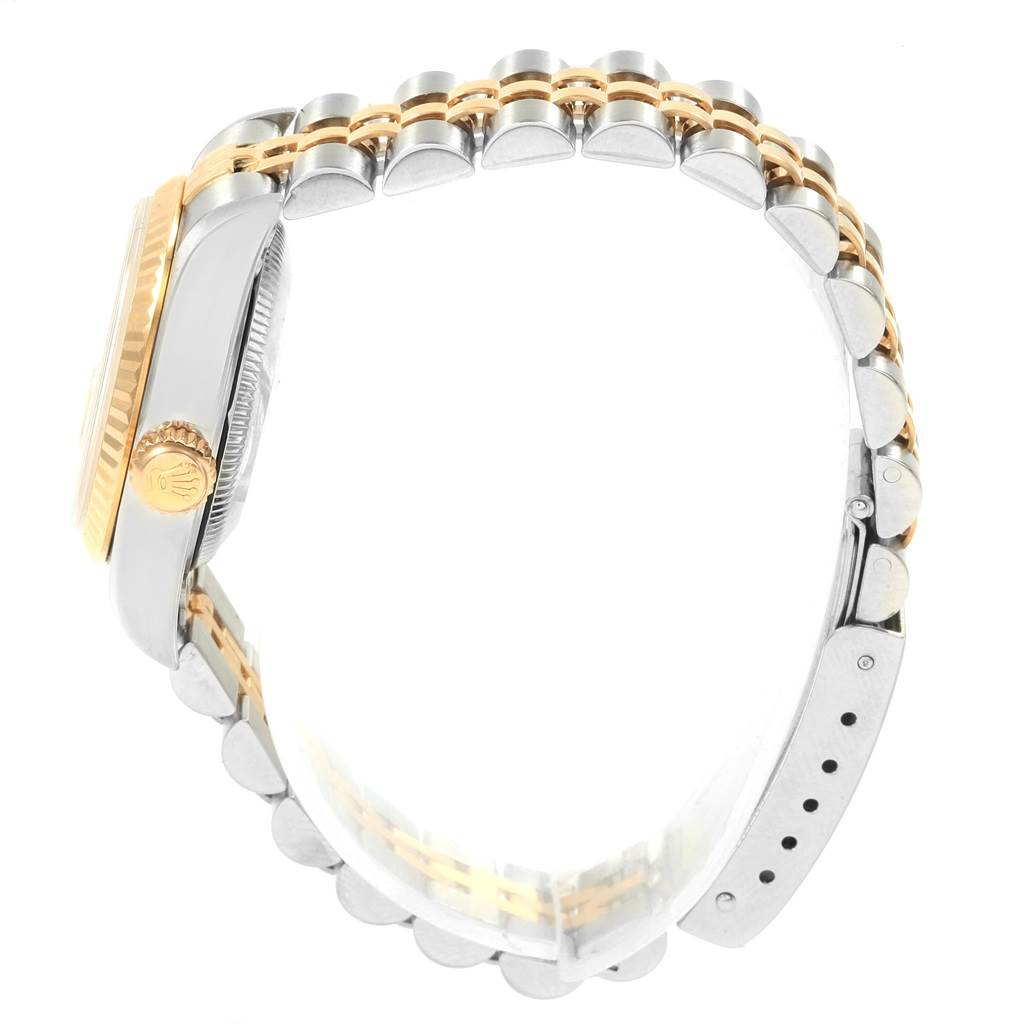 The image shows a side view of the Rolex Datejust 79173 Women's Steel and Gold (two tone) Champagne Dial 79173 Women's Steel and Gold (two tone) Champagne Dial watch, featuring its two-tone jubilee bracelet and crown.