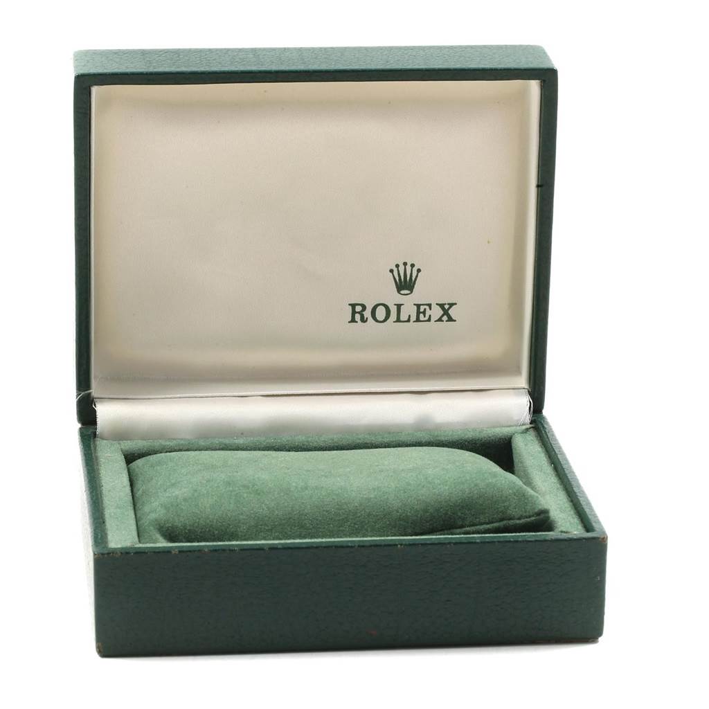 The image shows an open green Rolex Datejust 79173 Women's Steel and Gold (two tone) Silver Dial 79173 Women's Steel and Gold (two tone) Silver Dial watch box with a cushion inside.