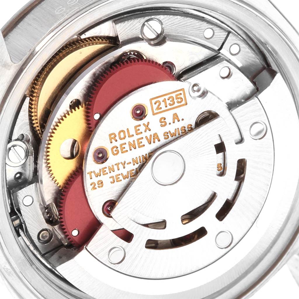 The image shows a close-up view of the Rolex Datejust 69174 Women's Stainless Steel Silver Dial 69174 Women's Stainless Steel Silver Dial model's movement, showcasing its intricate gears and components.