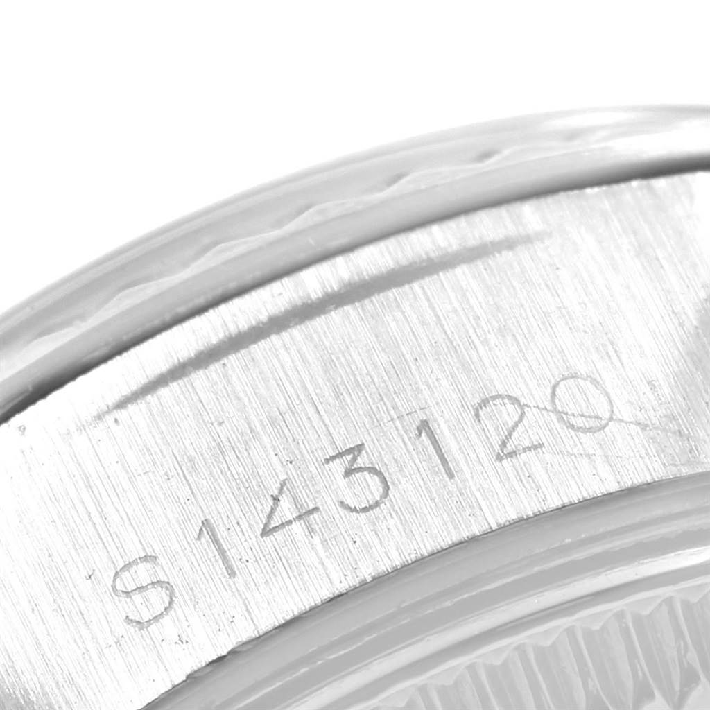 This close-up image shows the serial number engraved on the inner rim of a Rolex Datejust 69174 Women's Stainless Steel Silver Dial 69174 Women's Stainless Steel Silver Dial watch.
