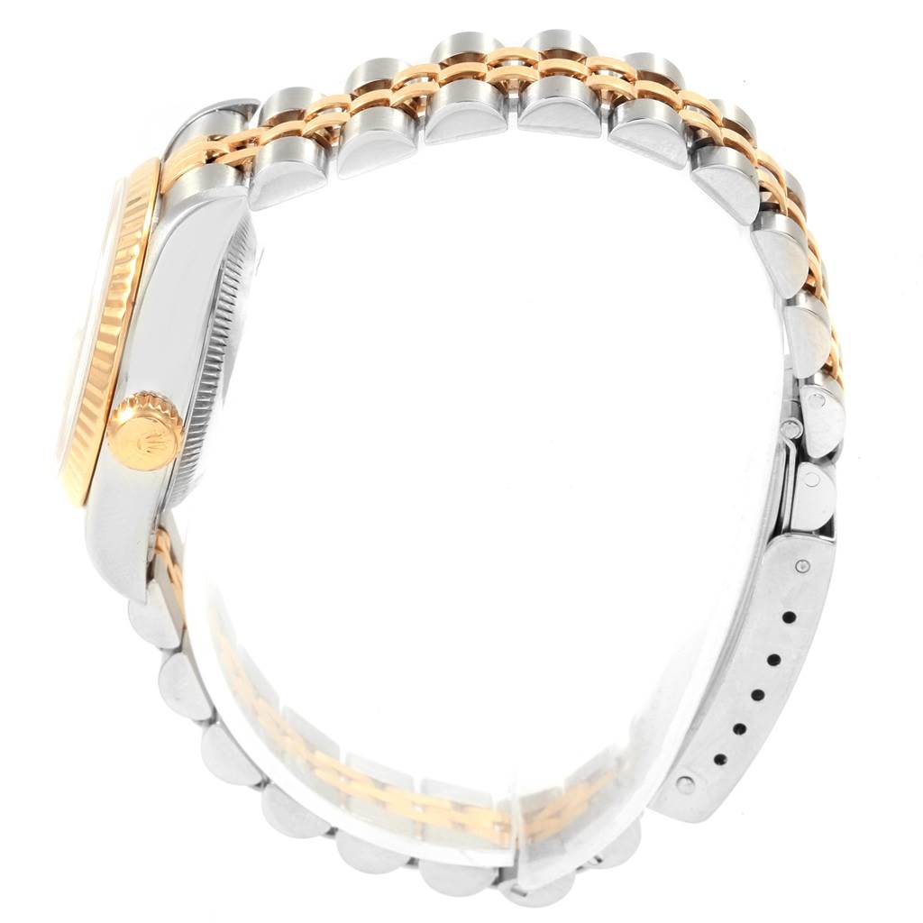 The image shows a side view of a Rolex Datejust 19784 Women's Stainless Steel White Dial 19784 Women's Stainless Steel White Dial watch, highlighting the crown, bezel, and two-tone bracelet.