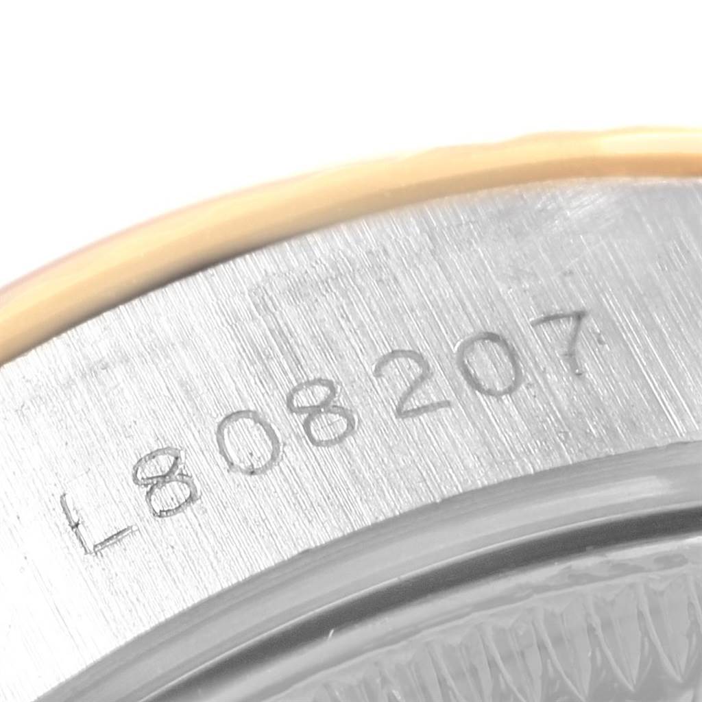 This image shows a close-up view of the serial number engraved on the side of a Rolex Datejust 69173 Women's Stainless Steel Champagne Dial 69173 Women's Stainless Steel Champagne Dial watch.