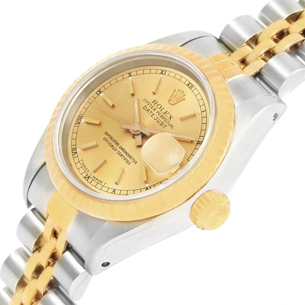 This image shows the Rolex Datejust 69173 Women's Stainless Steel Champagne Dial 69173 Women's Stainless Steel Champagne Dial watch from a 3/4 angle, highlighting the gold bezel, dial, crown, and two-tone bracelet.