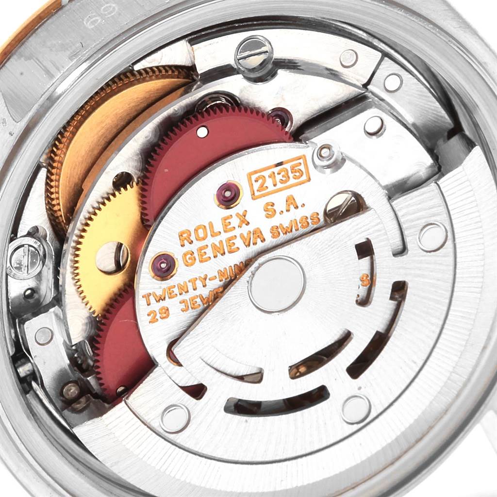 This image shows the internal mechanism of a Rolex Datejust 69173 Women's Stainless Steel Champagne Dial 69173 Women's Stainless Steel Champagne Dial watch, highlighting gears and the rotor.