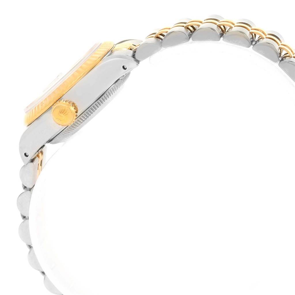 This image shows a side view of the Rolex Datejust 69173 Women's Stainless Steel Champagne Dial 69173 Women's Stainless Steel Champagne Dial watch, highlighting the crown, bezel, and part of the bracelet.