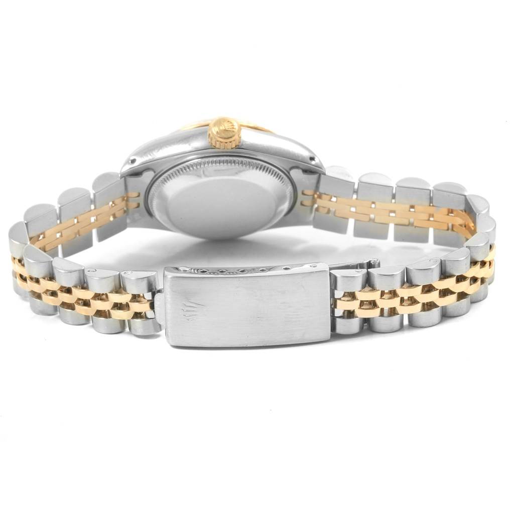 The image shows the back view of a Rolex Datejust 69173 Women's Stainless Steel Champagne Dial 69173 Women's Stainless Steel Champagne Dial watch case, crown, and two-tone bracelet.