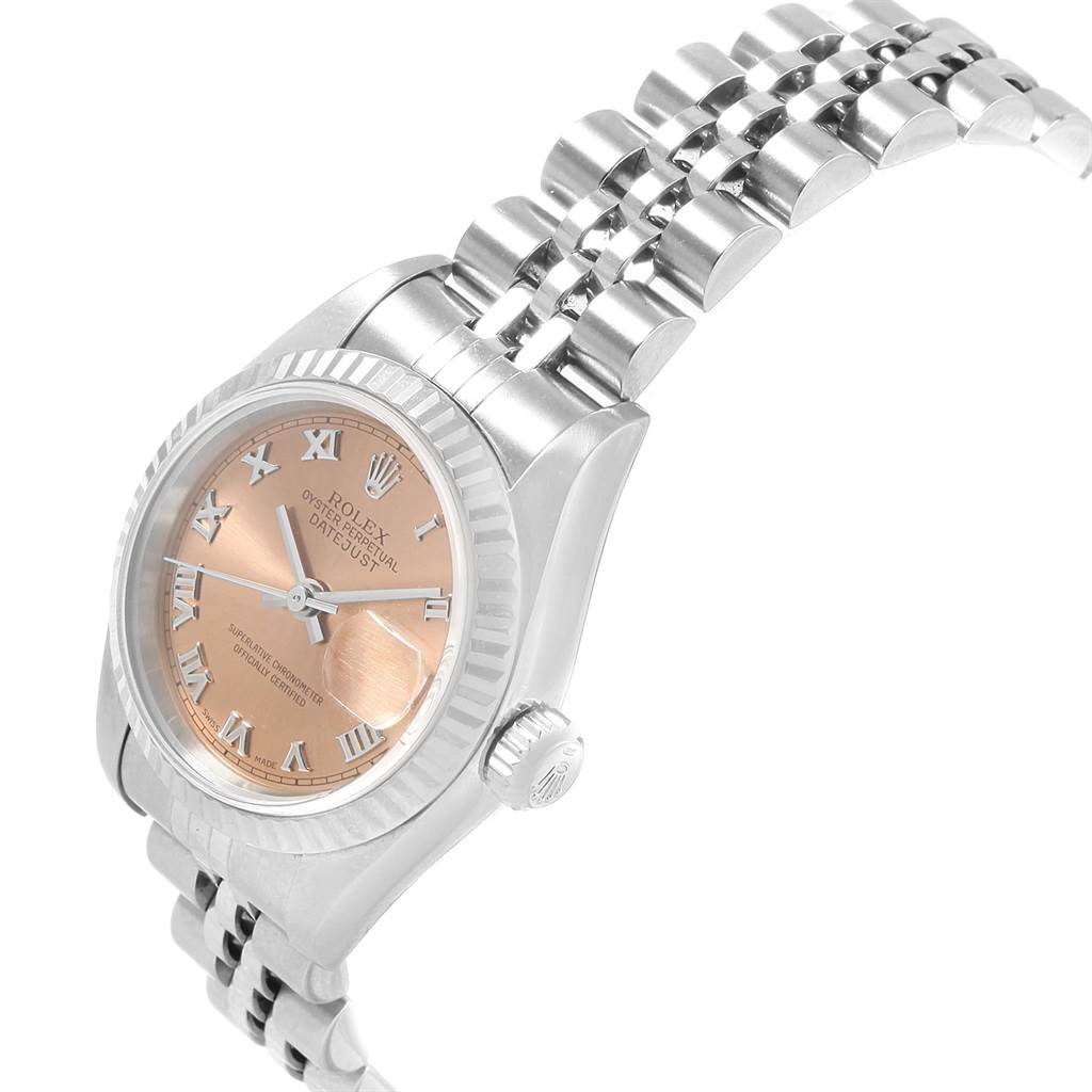 The image shows a side and slightly angled view of a Rolex Datejust 79174 Women
s Stainless Steel Pink Dial 79174 Women
s Stainless Steel Pink Dial watch displaying the dial, bezel, crown, and part of the bracelet.