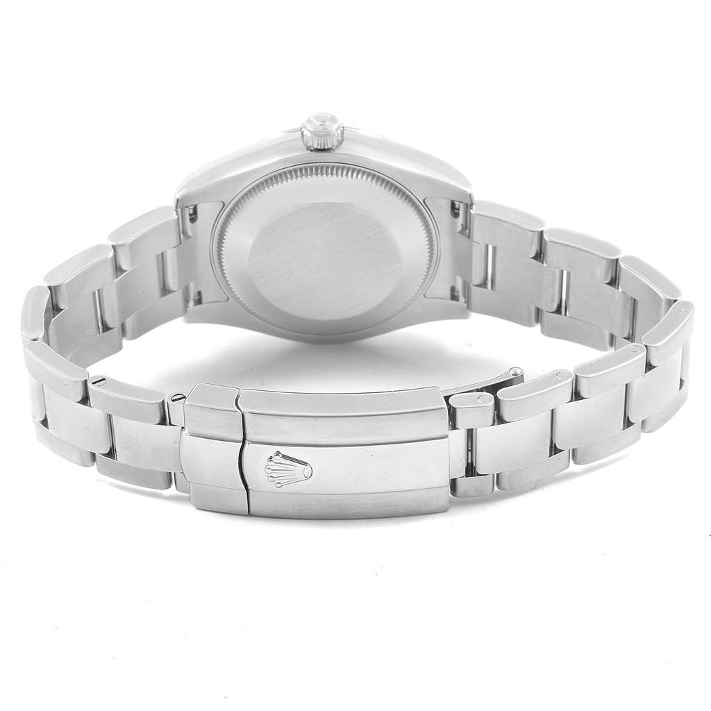 This image shows the backside of a Rolex Datejust 178274 Women's Stainless Steel Silver Dial 178274 Women's Stainless Steel Silver Dial watch, including its case and metal bracelet with a crown logo on the clasp.