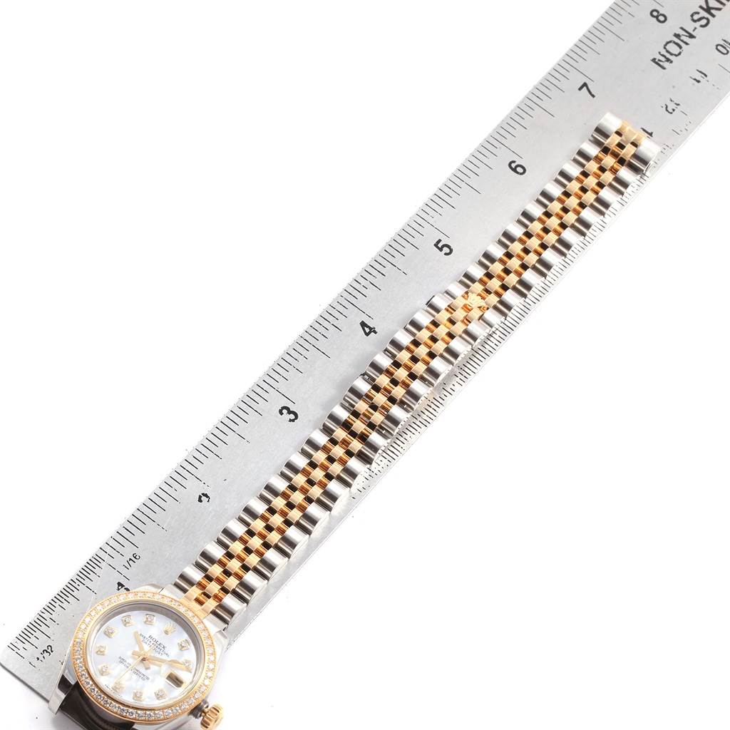 The image shows a Rolex Datejust 179383 Women's Steel and Gold (two tone) Mother of Pearl Dial 179383 Women's Steel and Gold (two tone) Mother of Pearl Dial watch with the face partially visible and the band laid out next to a ruler for measurement.