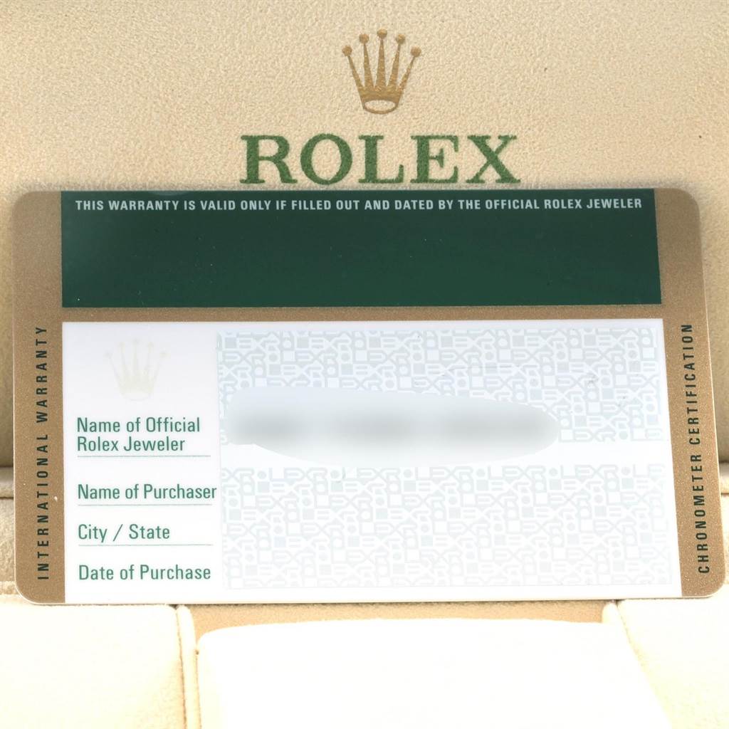 This image shows a close-up of the warranty card included with the Rolex Datejust 179383 Women's Steel and Gold (two tone) Mother of Pearl Dial 179383 Women's Steel and Gold (two tone) Mother of Pearl Dial watch.