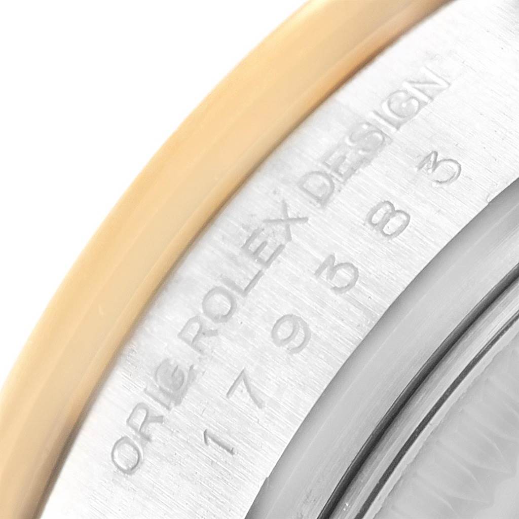 This image shows a close-up of the engraved serial number and "Orig Rolex Design" on the side of a Rolex Datejust 179383 Women's Steel and Gold (two tone) Mother of Pearl Dial 179383 Women's Steel and Gold (two tone) Mother of Pearl Dial watch case.