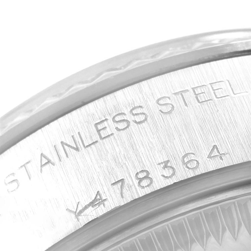 This image shows a close-up of the stainless steel caseback edge of a Rolex Datejust 79174 Women
s Stainless Steel Pink Dial 79174 Women
s Stainless Steel Pink Dial watch, displaying part of its model number.