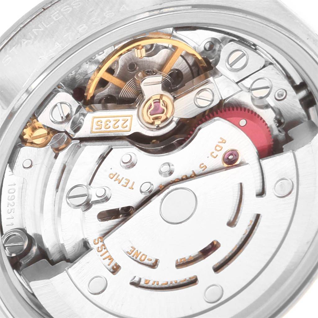 This image shows a close-up of the movement mechanism of a Rolex Datejust 79174 Women
s Stainless Steel Pink Dial 79174 Women
s Stainless Steel Pink Dial watch.