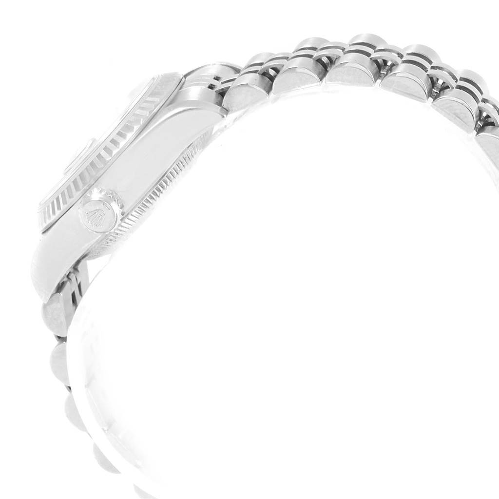 The image shows a side view of the Rolex Datejust 79174 Women
s Stainless Steel Pink Dial 79174 Women
s Stainless Steel Pink Dial watch, highlighting the crown, case, and part of the bracelet.