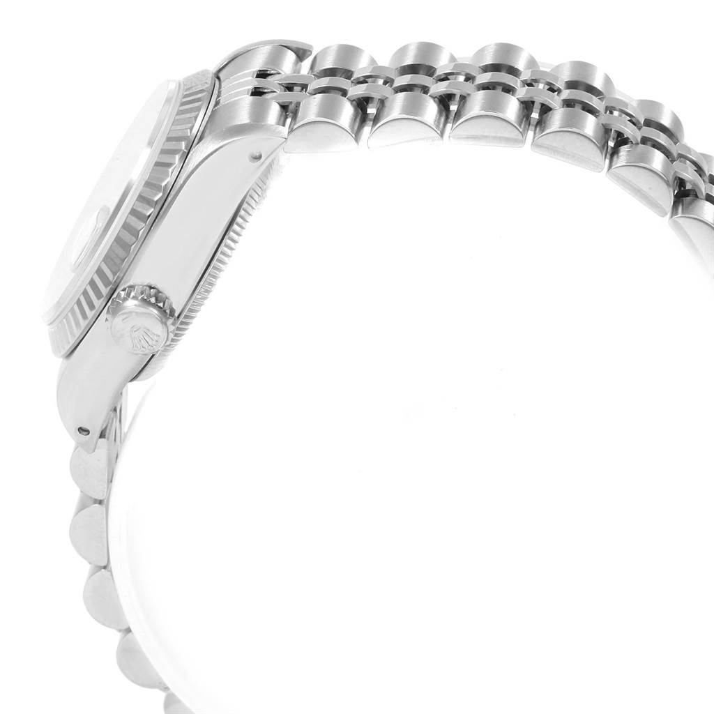 The image shows a side view of a Rolex Datejust 69174 Women's Stainless Steel Silver Dial 69174 Women's Stainless Steel Silver Dial watch, focusing on the side of the case and the bracelet.