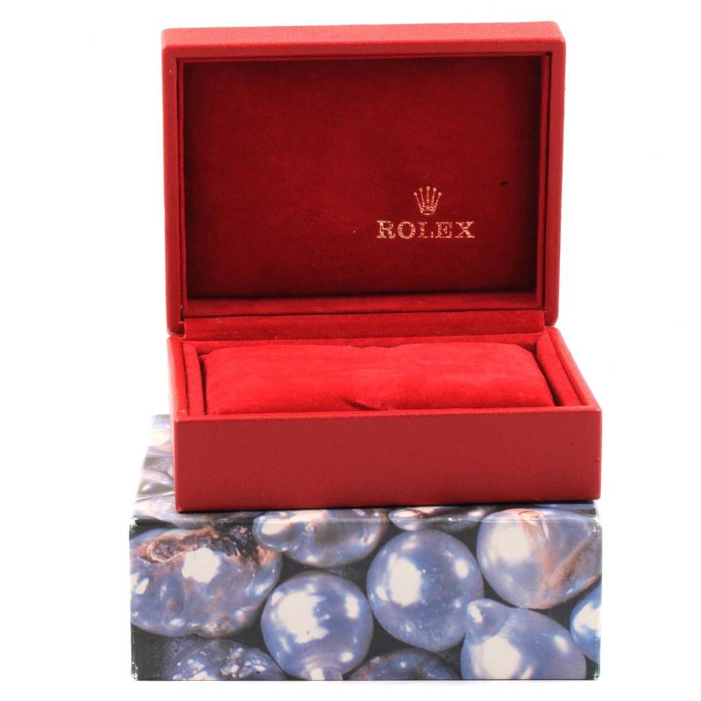 This image shows an open red Rolex box for the Datejust model, displayed at a straight-on angle.