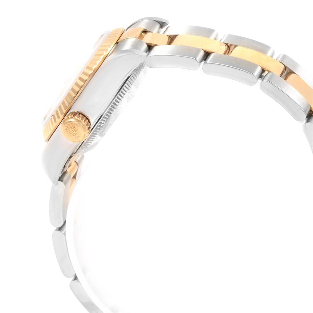 This image shows a side view of the Rolex Datejust 69173 Women's Stainless Steel White Dial 69173 Women's Stainless Steel White Dial watch case, crown, and part of its bracelet.