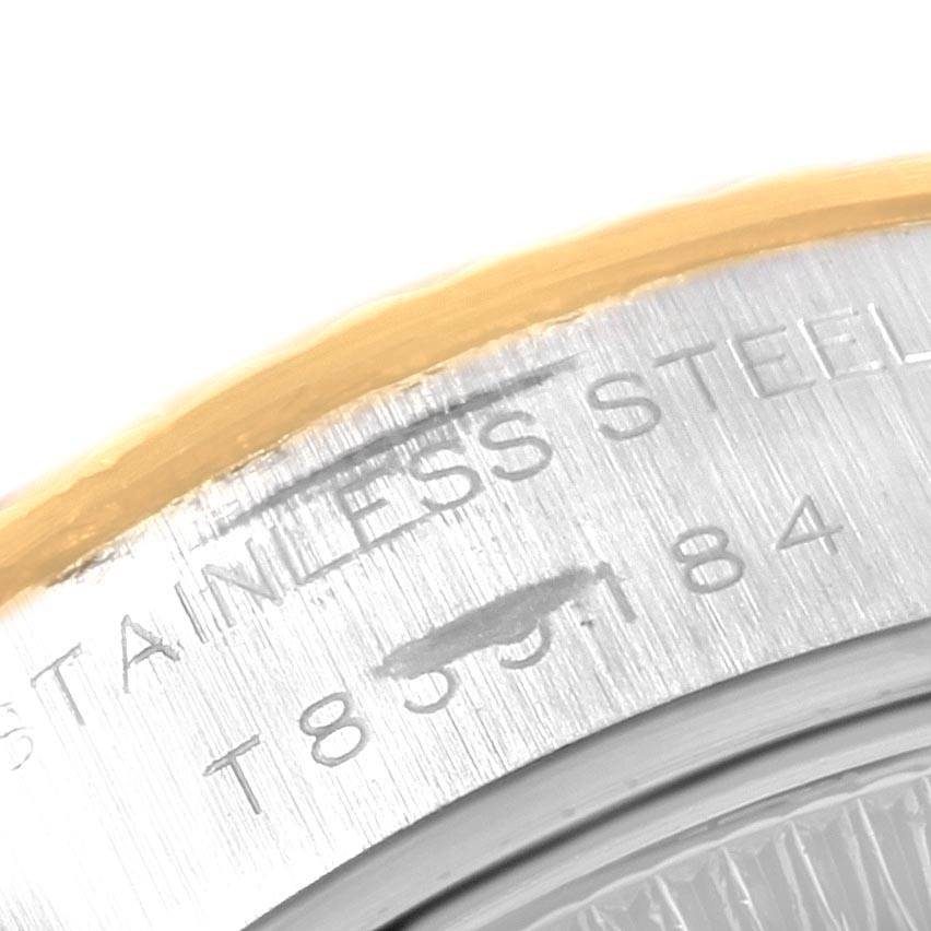 The image shows a close-up of the bezel and part of the brushed stainless steel case back of a Rolex Datejust 69173 Women's Stainless Steel White Dial 69173 Women's Stainless Steel White Dial watch.