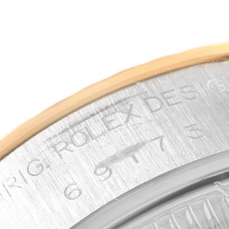 The image shows a close-up of the side-view of the back casing of a Rolex Datejust 69173 Women's Stainless Steel White Dial 69173 Women's Stainless Steel White Dial watch.