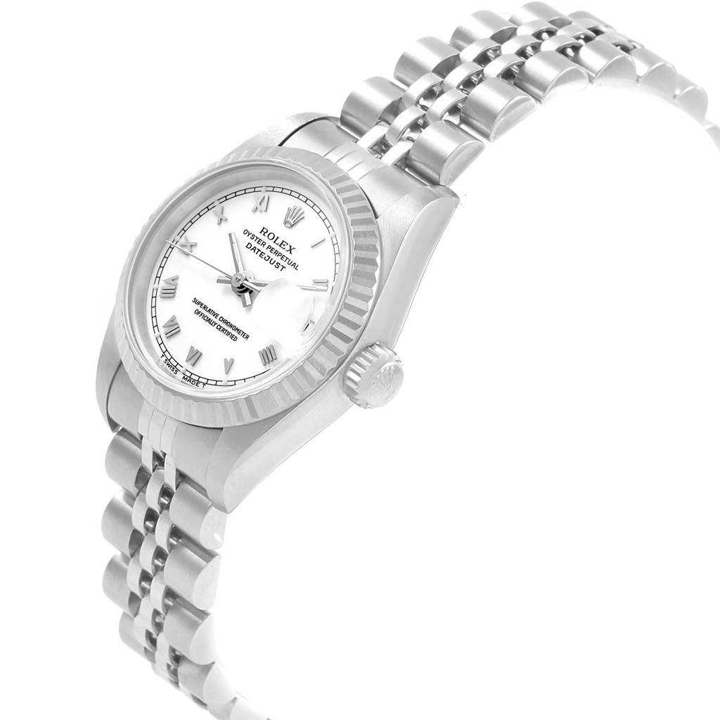 The Rolex Datejust 69174 Women's Stainless Steel White Dial 69174 Women's Stainless Steel White Dial watch is shown at a tilted angle, displaying its face, crown, and part of the bracelet.