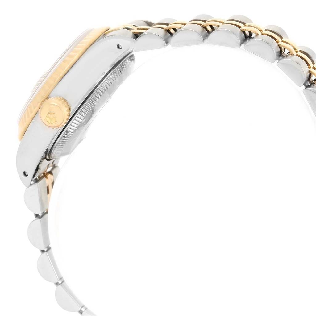 This image shows a side view of a Rolex Datejust 69173 Women's Stainless Steel Champagne Dial 69173 Women's Stainless Steel Champagne Dial watch highlighting its crown, case, and part of the bracelet.