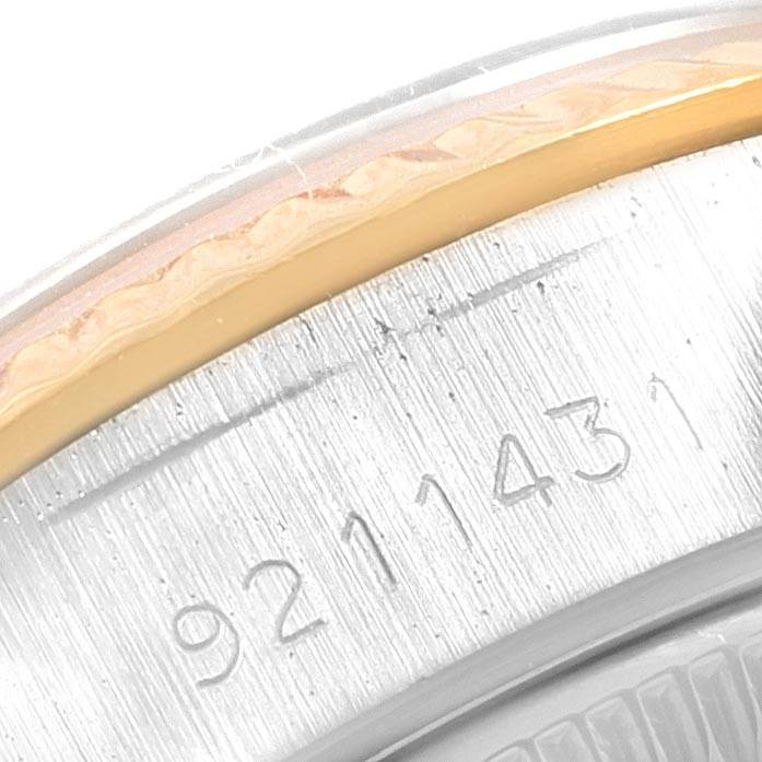 This image shows a close-up angle of the edge of a Rolex Datejust 69173 Women's Stainless Steel Champagne Dial 69173 Women's Stainless Steel Champagne Dial watch, highlighting its serial number.
