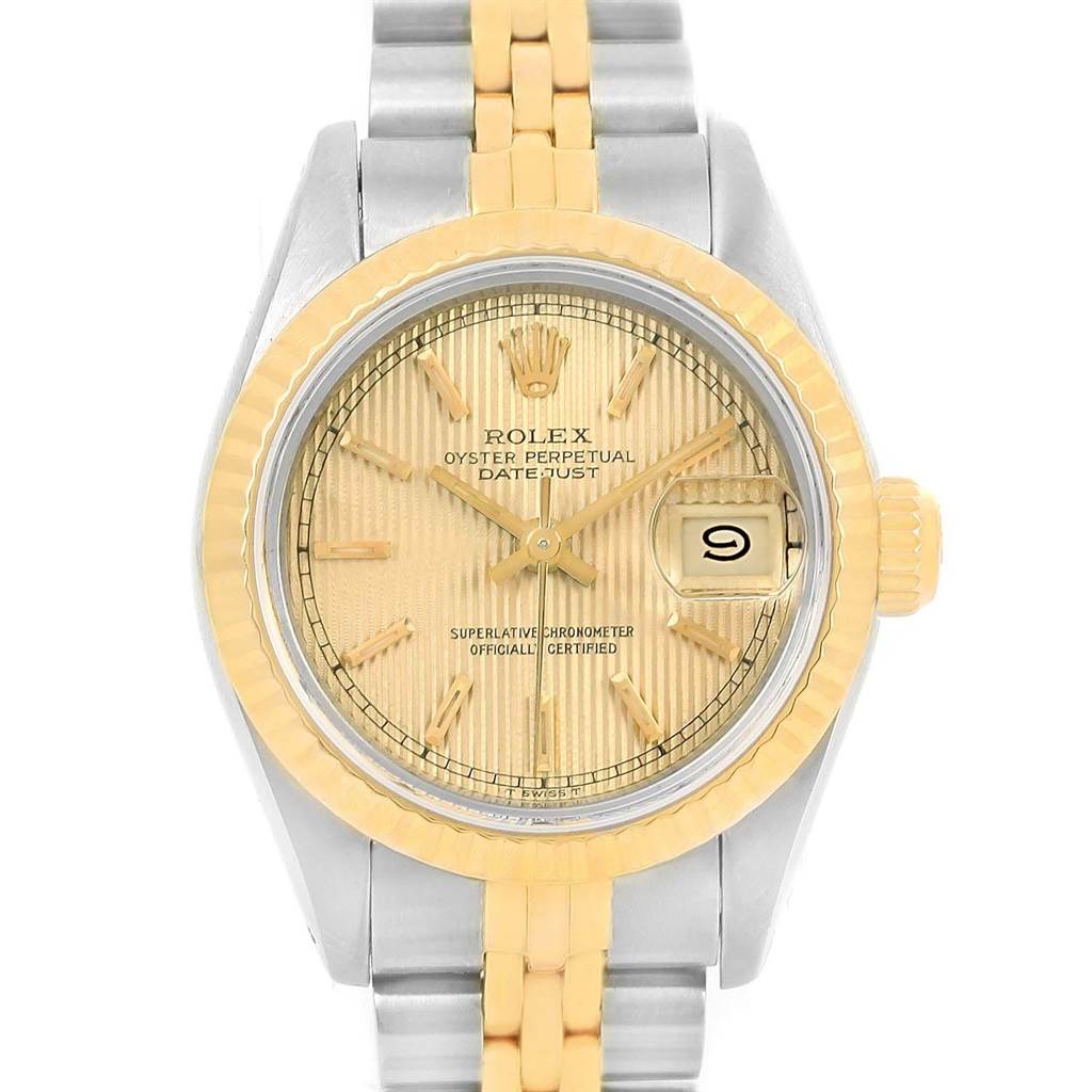 This is a frontal view of a Rolex Datejust 69173 Women's Stainless Steel Champagne Dial 69173 Women's Stainless Steel Champagne Dial watch showing the dial, bezel, and part of the bracelet.