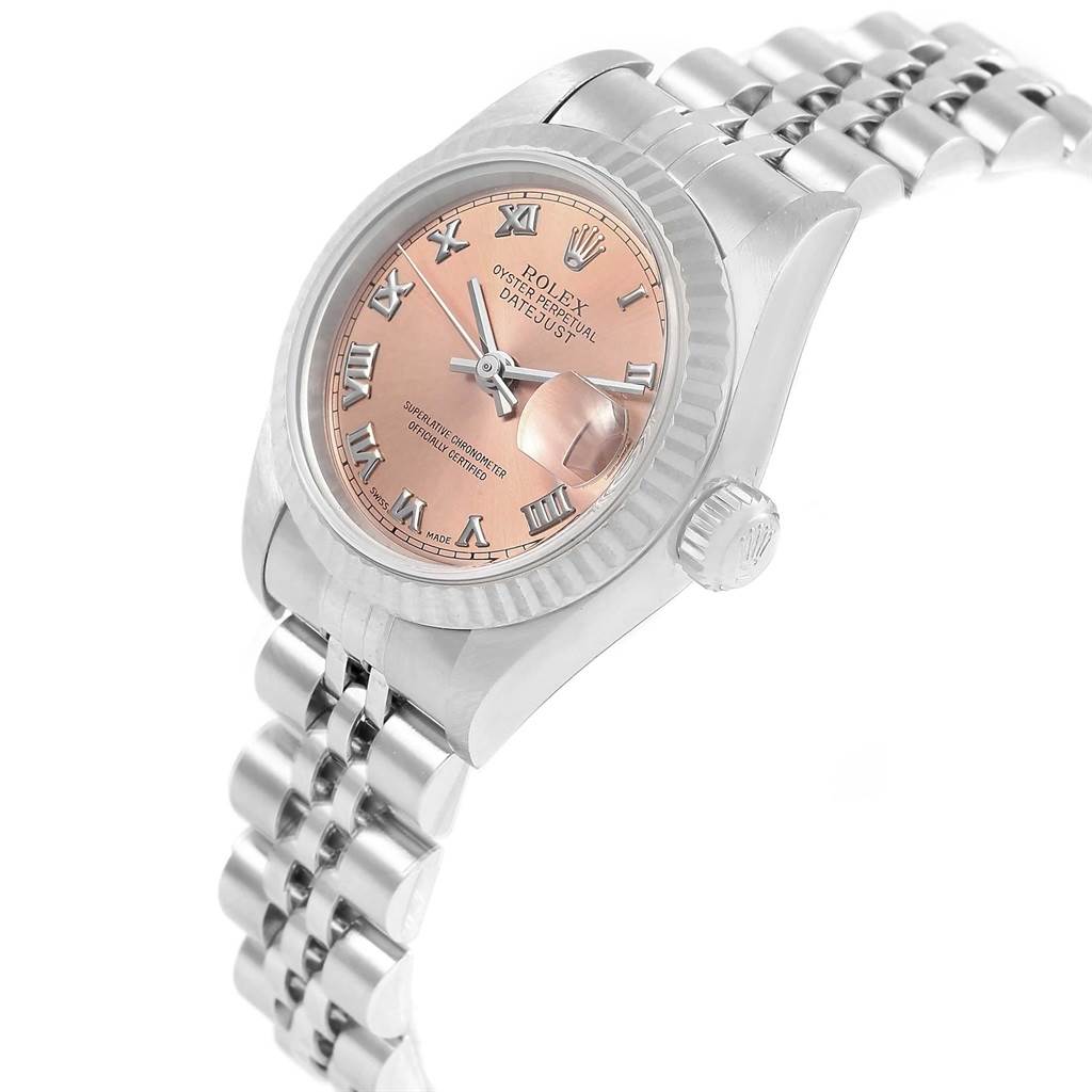 The image shows a Rolex Datejust 79174 Women's Stainless Steel Pink Dial 79174 Women's Stainless Steel Pink Dial watch from a three-quarter angle focusing on its face, crown, and bracelet.