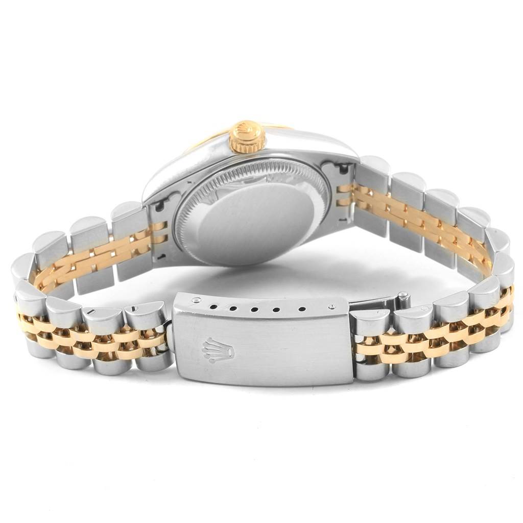 The image shows the back view of a Rolex Datejust 69173 Women
s Stainless Steel White Dial 69173 Women
s Stainless Steel White Dial watch, highlighting its two-tone bracelet and closed clasp.