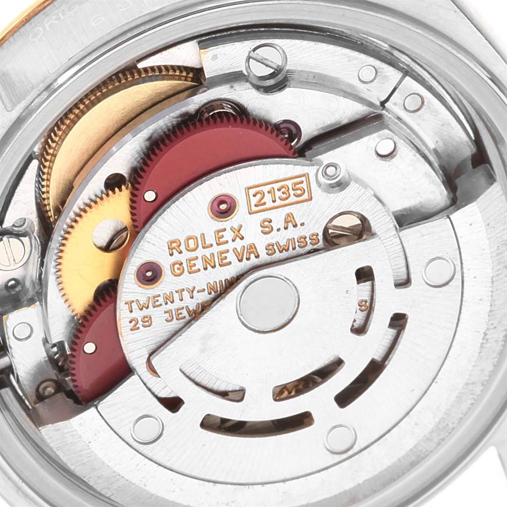 This is a close-up view of the Datejust Rolex watch movement, showcasing the internal gears and components.