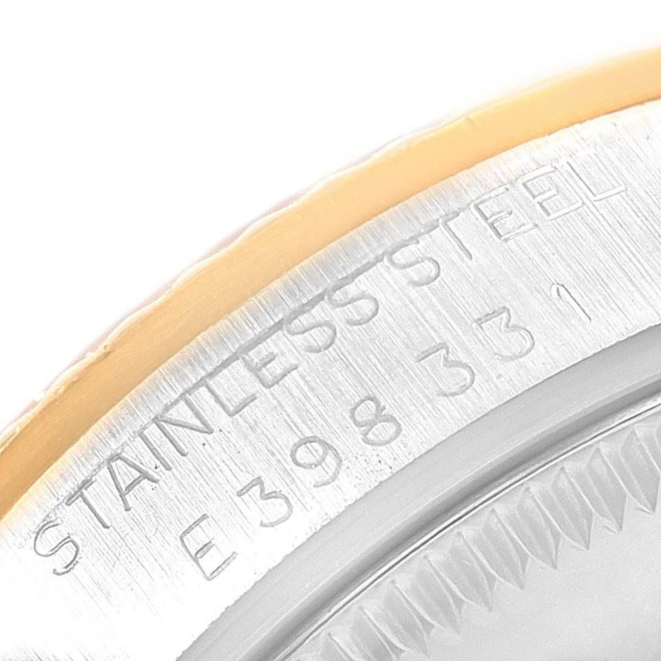 This image shows a close-up of the stainless steel case and part of the bezel of a Rolex Datejust 68273 Women's Steel and Gold (two tone) Champagne Dial 68273 Women's Steel and Gold (two tone) Champagne Dial watch.