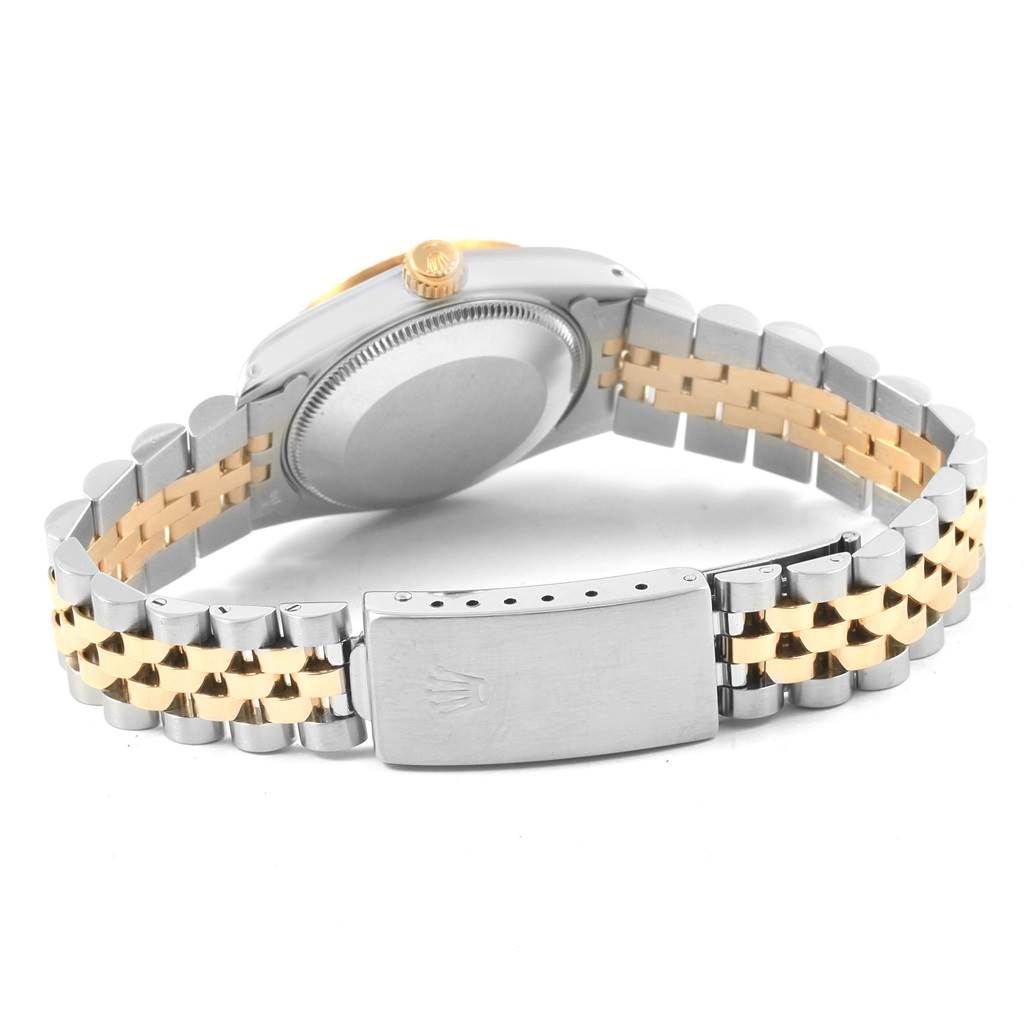 The image shows the back of a Rolex Datejust 68273 Women's Steel and Gold (two tone) Champagne Dial 68273 Women's Steel and Gold (two tone) Champagne Dial watch, highlighting its two-tone bracelet and clasp.