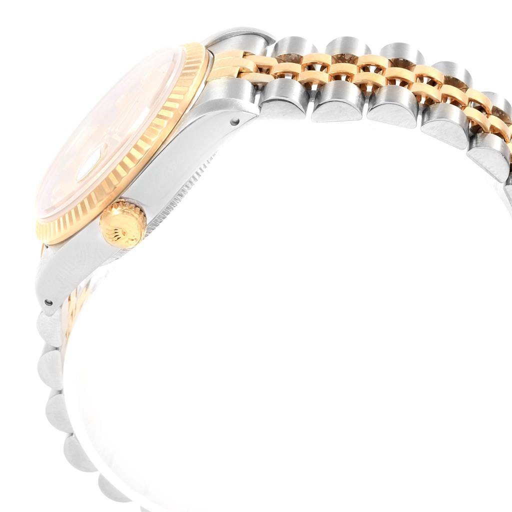 The image shows a side angle of the Rolex Datejust 68273 Women's Steel and Gold (two tone) Champagne Dial 68273 Women's Steel and Gold (two tone) Champagne Dial watch featuring its crown and two-tone bracelet.