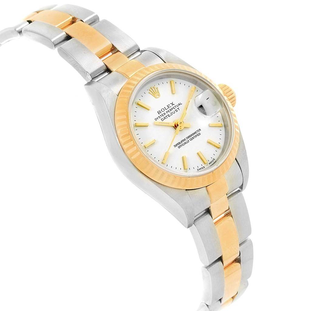 The image shows a side angle of a Rolex Datejust 79173 Women's Steel and Gold (two tone) White Dial 79173 Women's Steel and Gold (two tone) White Dial watch, highlighting its bezel, dial, and part of its bracelet.
