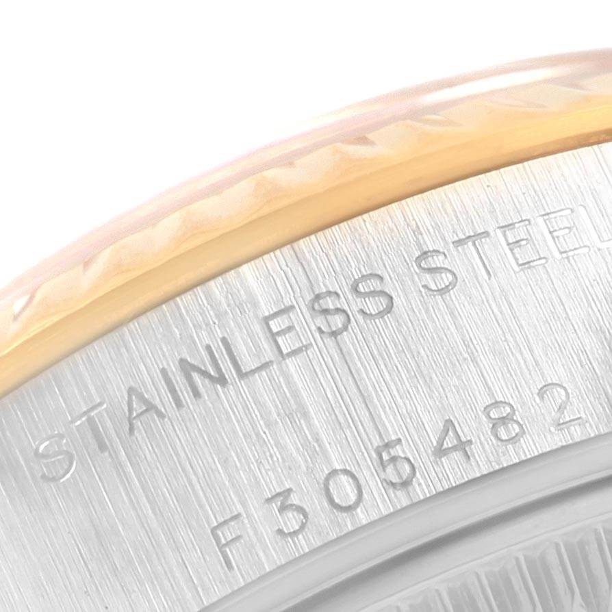 This close-up image shows the "STAINLESS STEEL" engraving and partial serial number on the case back edge of a Rolex Datejust 79173 Women's Steel and Gold (two tone) White Dial 79173 Women's Steel and Gold (two tone) White Dial watch.