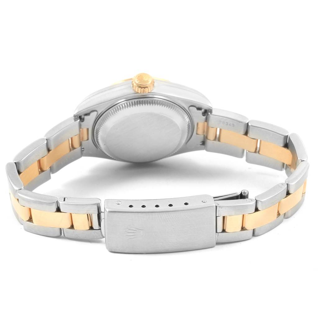 The image shows the back view of a Rolex Datejust 79173 Women's Steel and Gold (two tone) White Dial 79173 Women's Steel and Gold (two tone) White Dial watch, highlighting the case back, crown, and two-tone metal bracelet with a clasp.