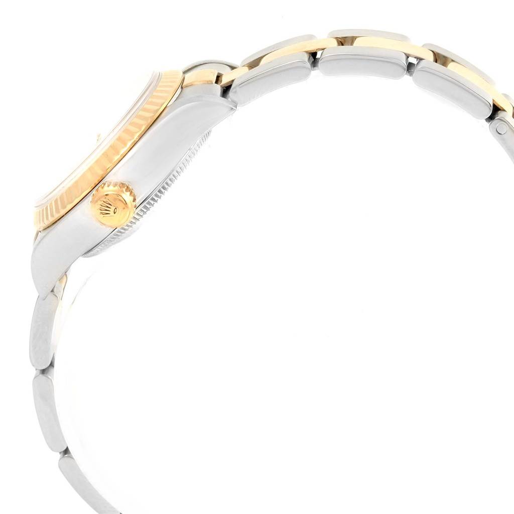 The image shows a side view of a Rolex Datejust 79173 Women's Steel and Gold (two tone) White Dial 79173 Women's Steel and Gold (two tone) White Dial watch, highlighting the crown, bezel, and part of the bracelet.