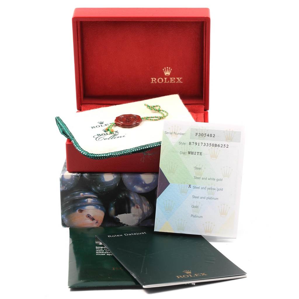 The image shows a Rolex Datejust 79173 Women's Steel and Gold (two tone) White Dial 79173 Women's Steel and Gold (two tone) White Dial watch box, authenticity card, manuals, and a Rolex tag.